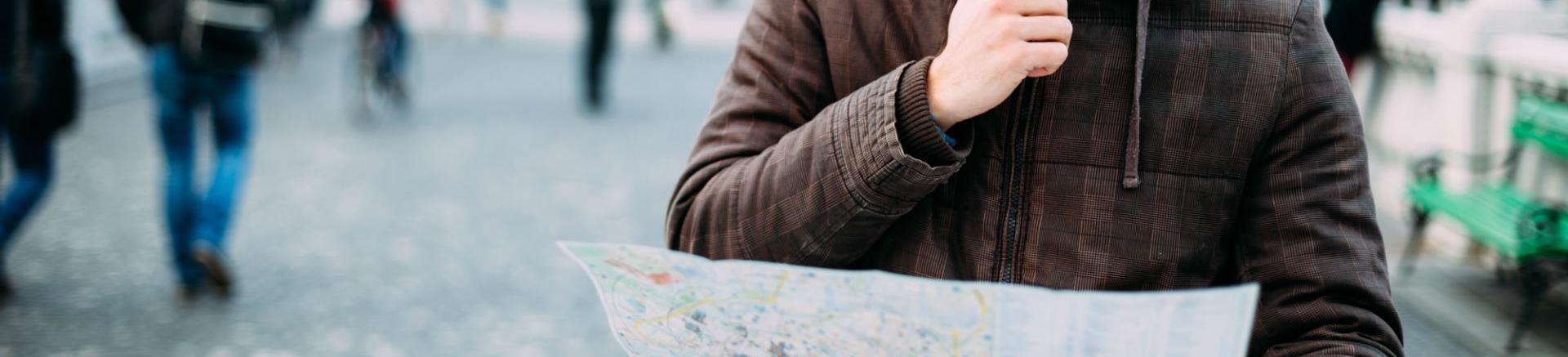 Man looking at a map for directions